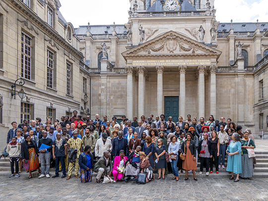 Conference attendees with Madame Diop